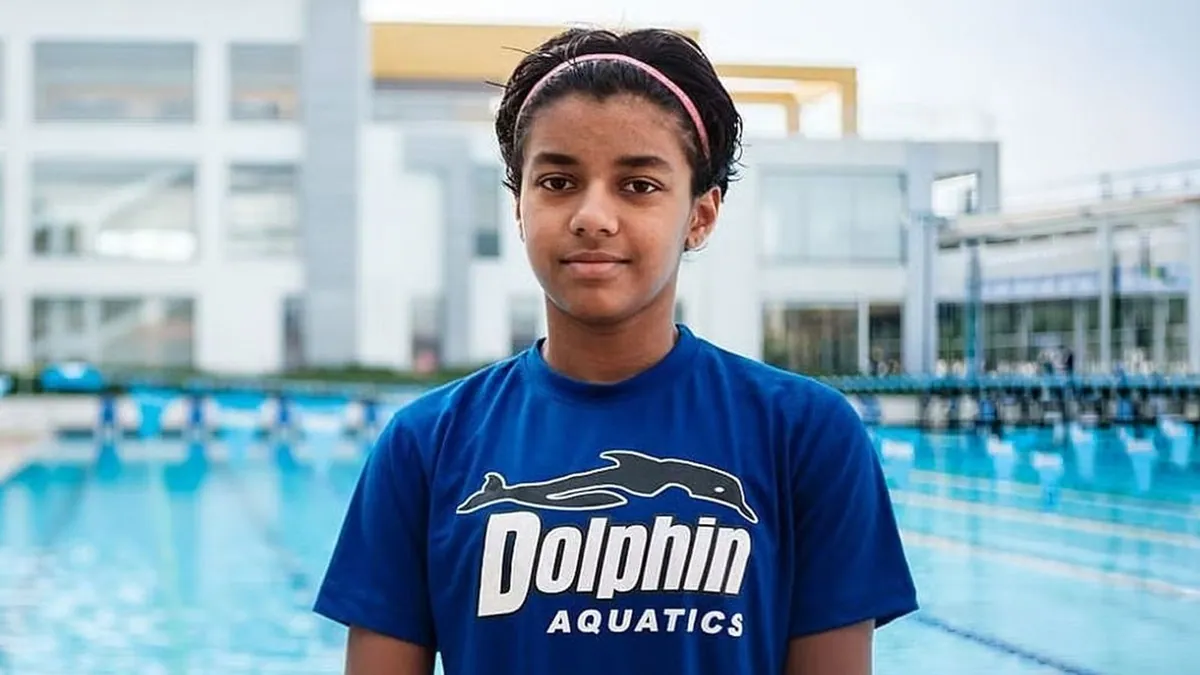 Swimmer Dhinidhi Desinghu at the poolside, after signing with Bajaj Finserv