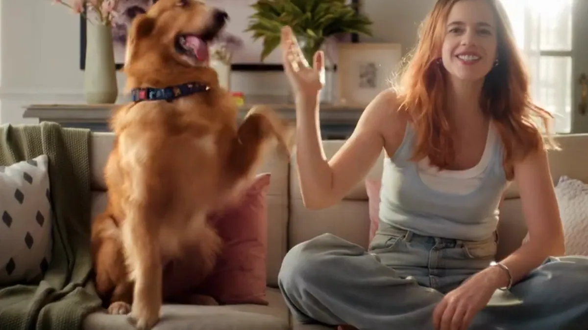 Kalki Koechlin sitting on a sofa beside her dog, from the Bark Out Loud campaign film about premium pet nutrition