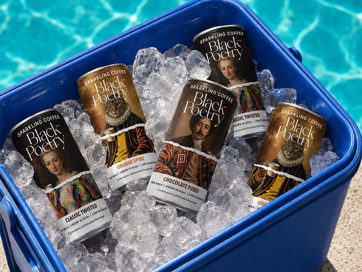 Black Poetry cans packed in ice inside a cool box beside a pool