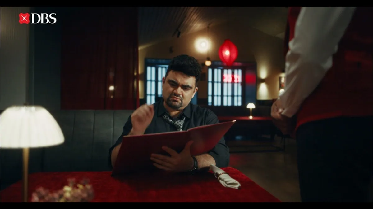 A family of business owners and their accountant in an everyday home setting, representing the DBS IDEAL business banking campaign