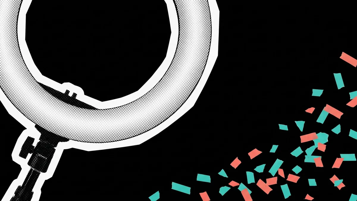 A ring light cropped by the corner of the frame with torn teal and coral fragments drifting away