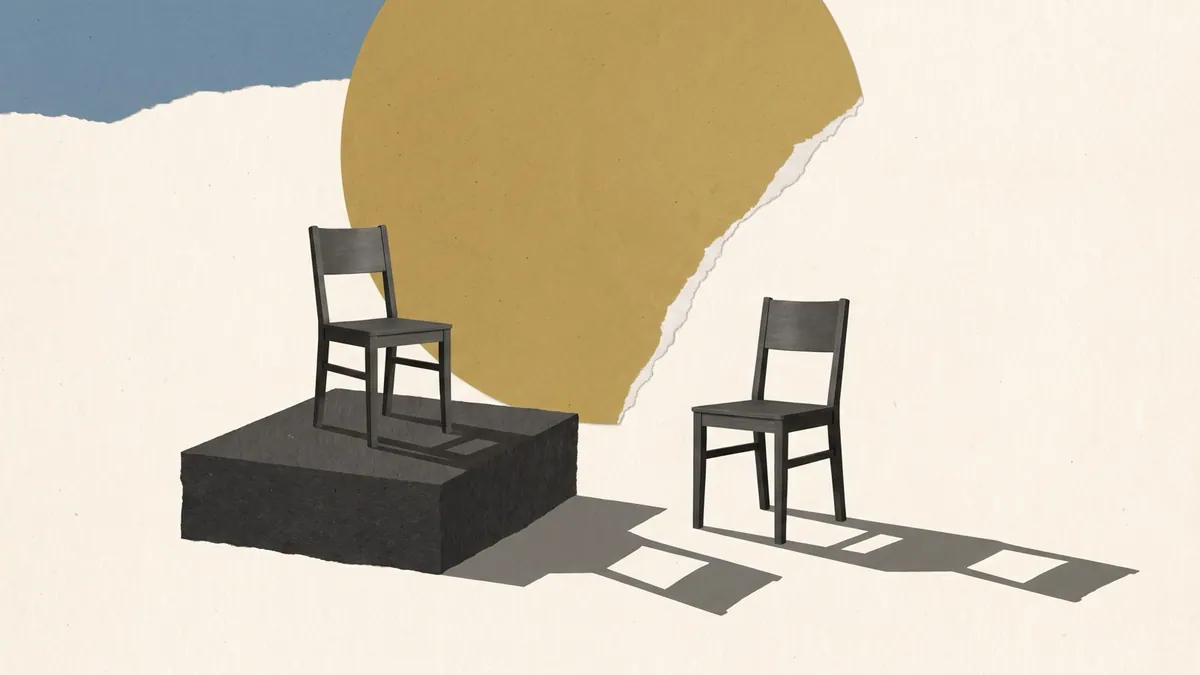 An empty chair on a raised platform and a second chair on the ground beside it, both casting long shadows