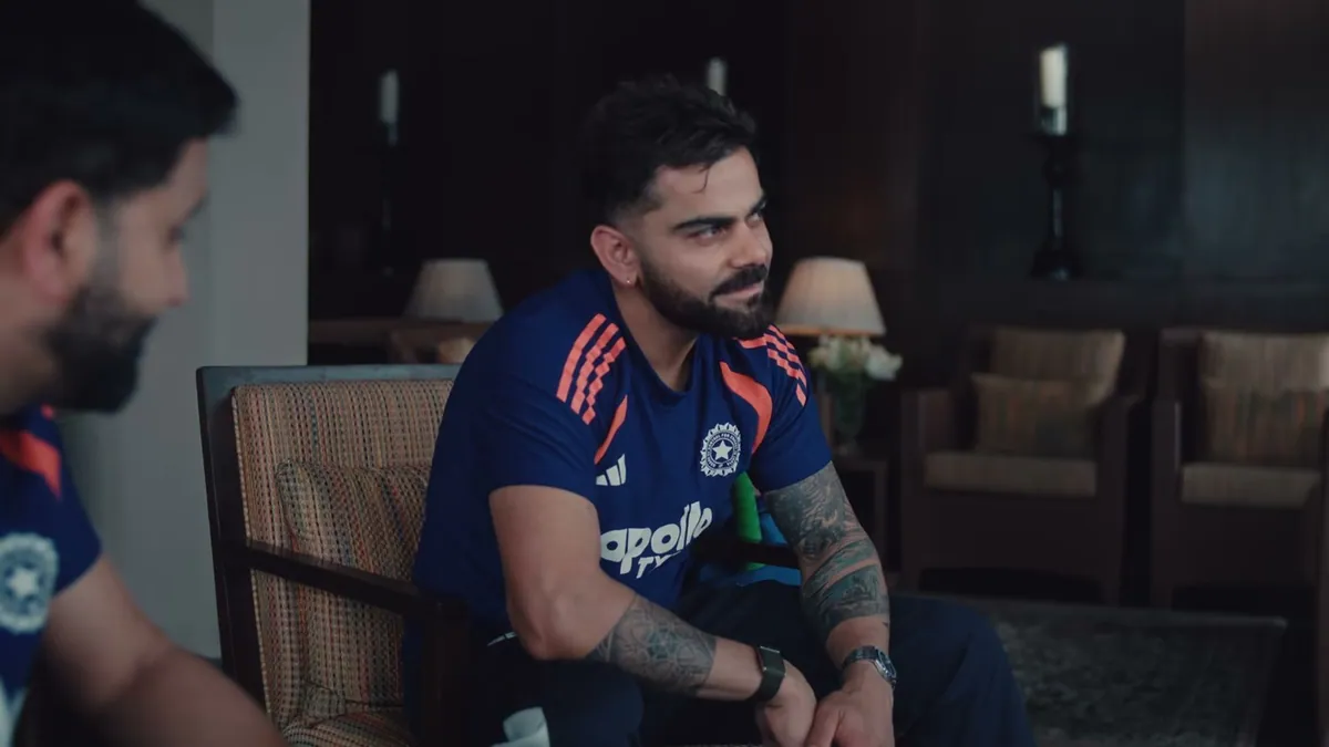 Virat Kohli mid-conversation with Rohit Sharma in profile beside him, from JioStar's World Cup 2027 promotional film