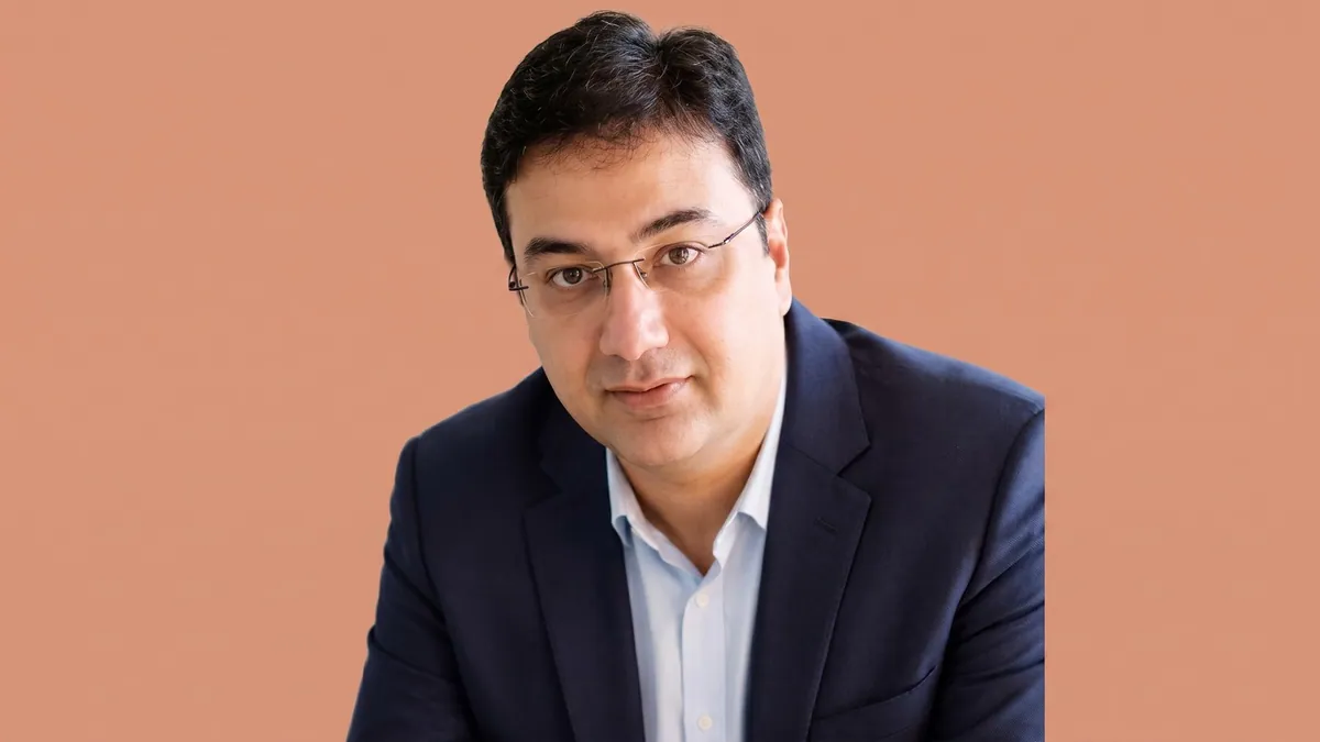 Karan Tandon, partner marketing lead for Netflix in South-East Asia and ANZ, photographed against a flat terracotta background