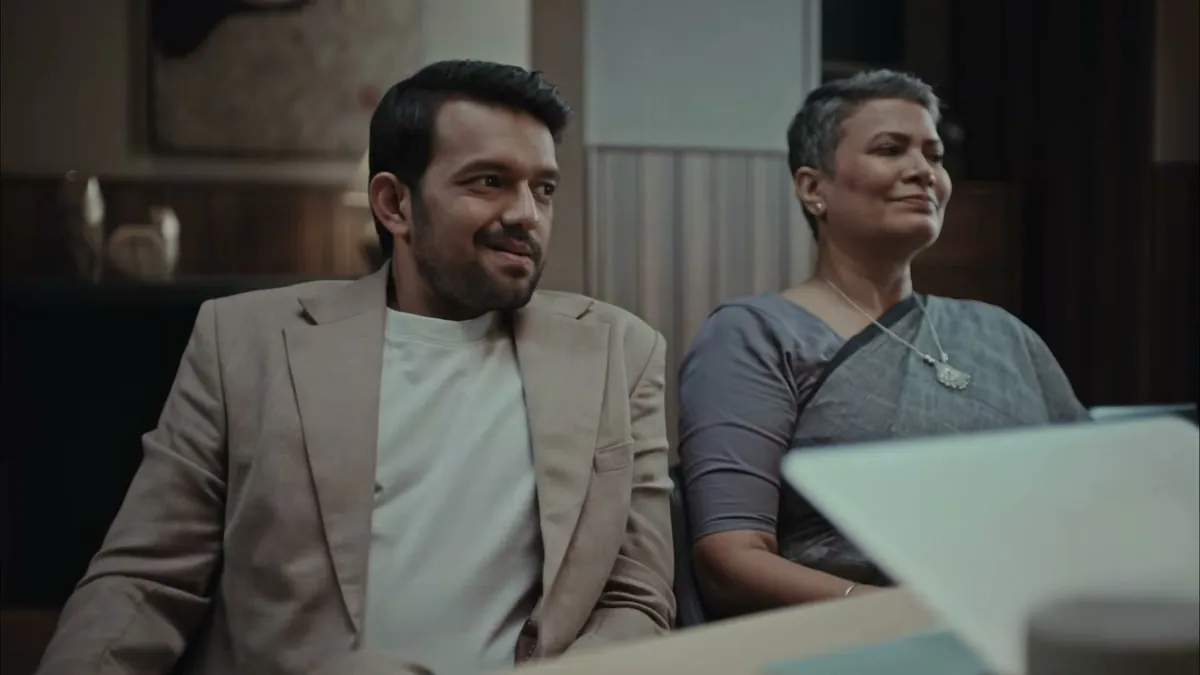 A frame from the Kissht campaign film, Sachin Tendulkar mid-hiccup holding a glass of water