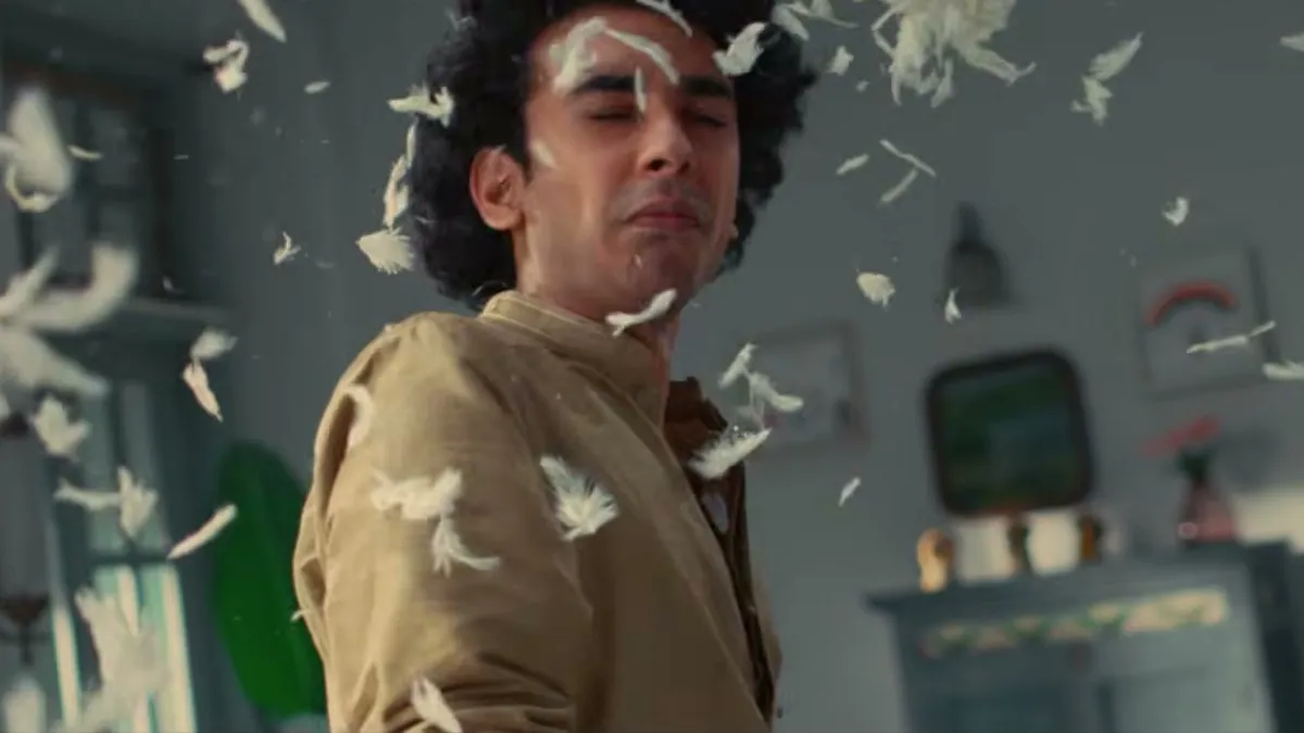 A brother covered in feathers mid pillow fight in the Mia by Tanishq Rakhi film