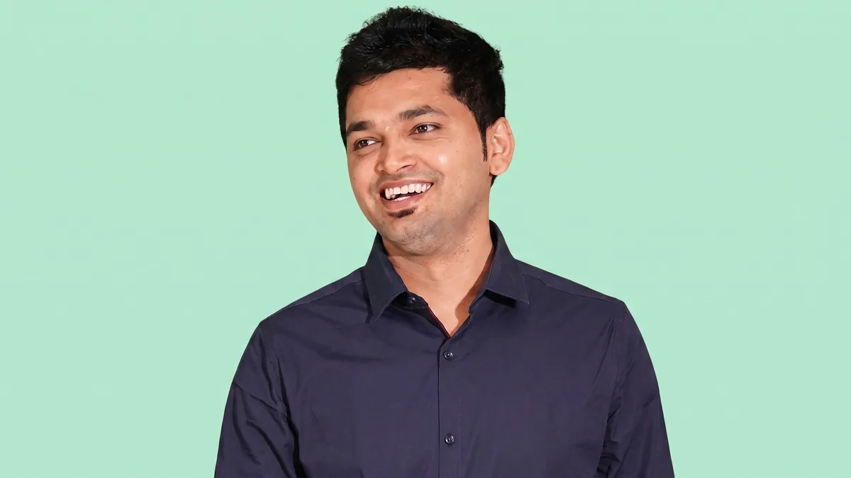 Rakesh Bhookya, head of growth at Way2News, photographed against a flat mint green background