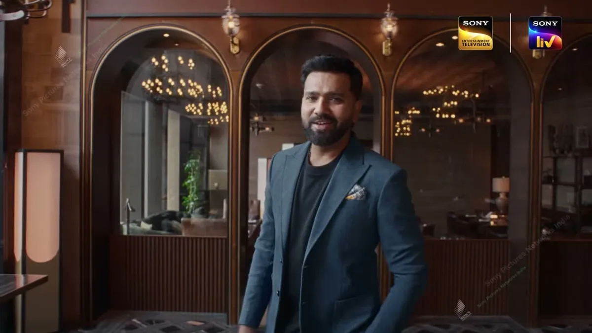 Rohit Sharma smiling in the restaurant set of Family Full House, in a frame from the show’s promo