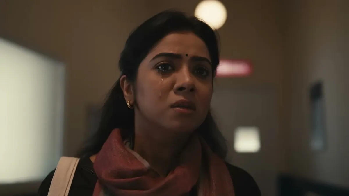 A tearful woman looks up in a hospital corridor, from the Star Health When India Looks Up In Worry film
