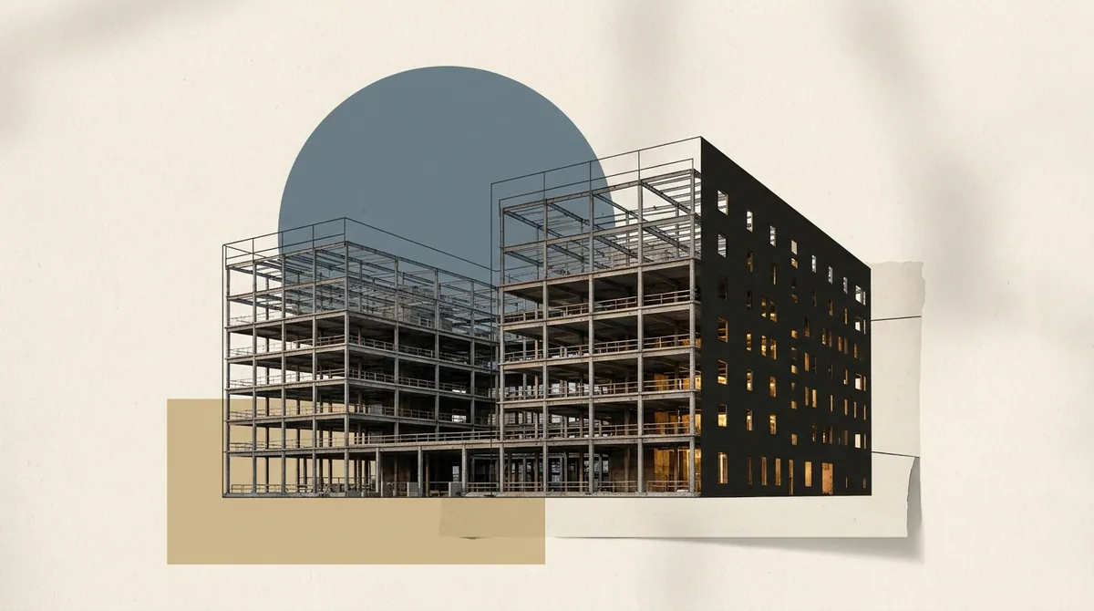 The outline of an unfinished building under construction, one wing complete and lit, the rest still scaffolding