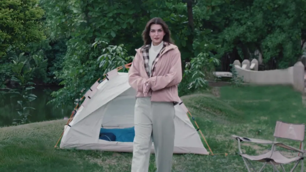 Kriti Sanon in a pink fleece jacket beside a tent, from the Uniqlo autumn and winter fleece campaign film