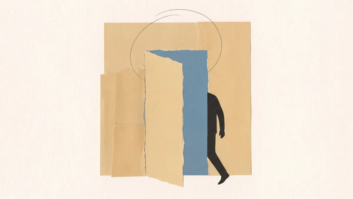 A door standing open in a wall of warm sand with a figure already past the frame